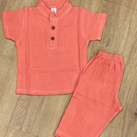 This image features is beige muslin co-ord set, consisting of a short-sleeve shirt and matching shorts.